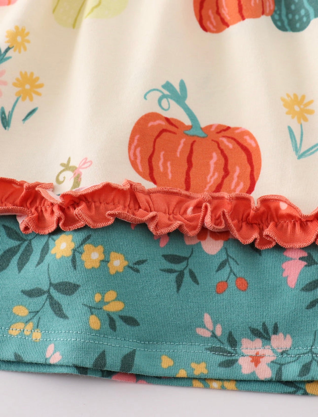 Platinum Pumpkin Ruffle Apron Dress